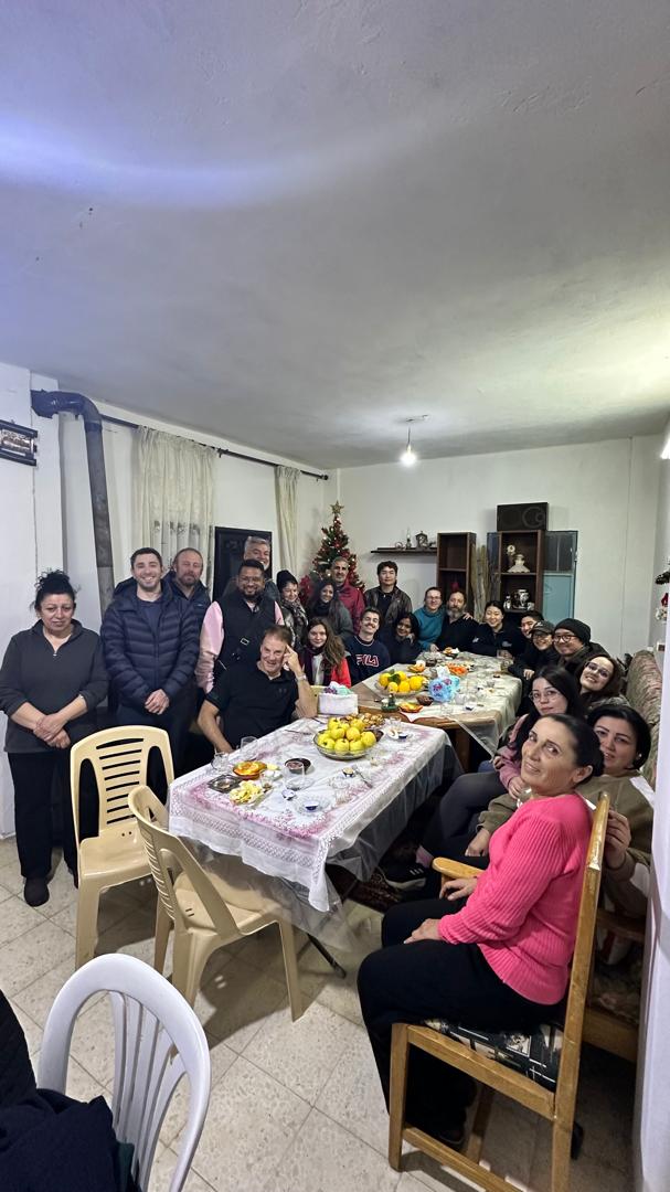Syrian Guides Christmas tour guests sharing dinner with a local family in Syria