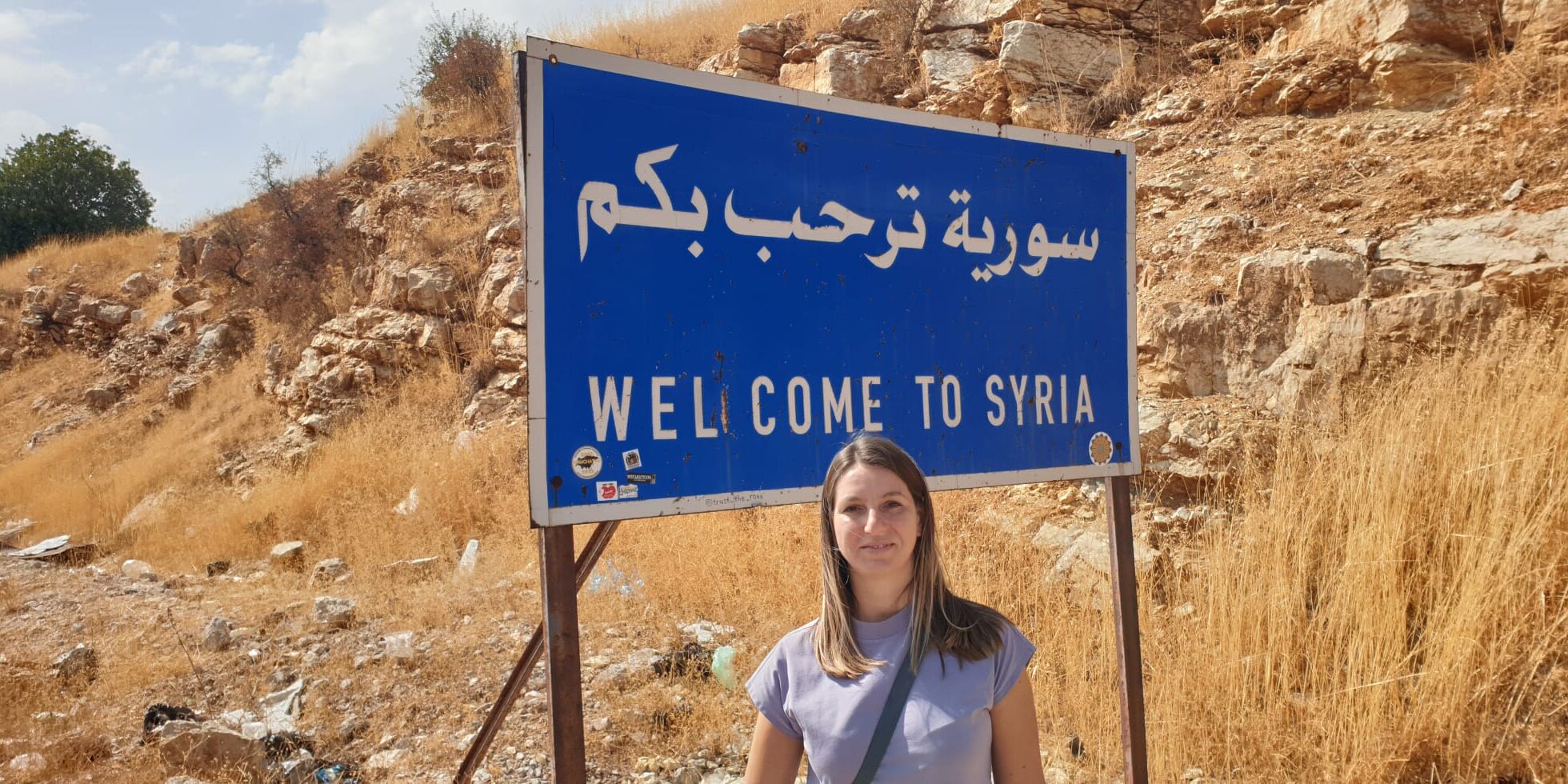 Albena with Welcome to Syria sign