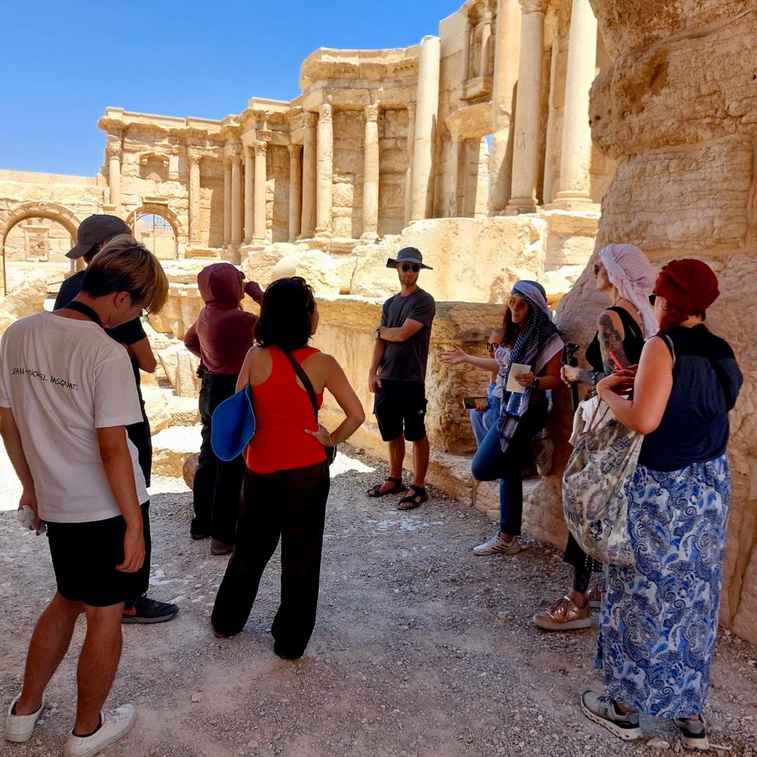 syrian guides group tour tourists in palmyra