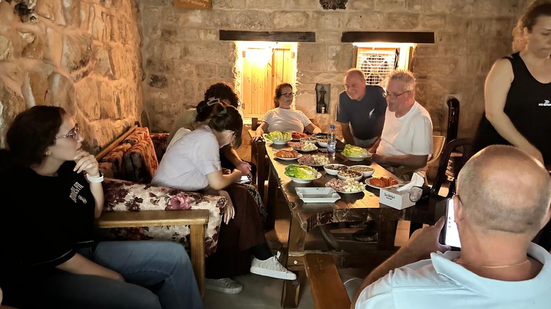 Guests sharing a wine tasting at a Syrian winery