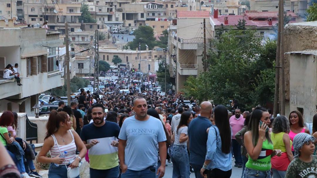 The celebration begins on the evening before the feast, as residents and visitors gather throughout the town.