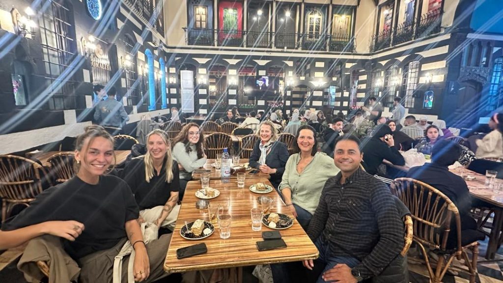 group of guests in Syria with Syrian Guides in Damascus at a restaurant