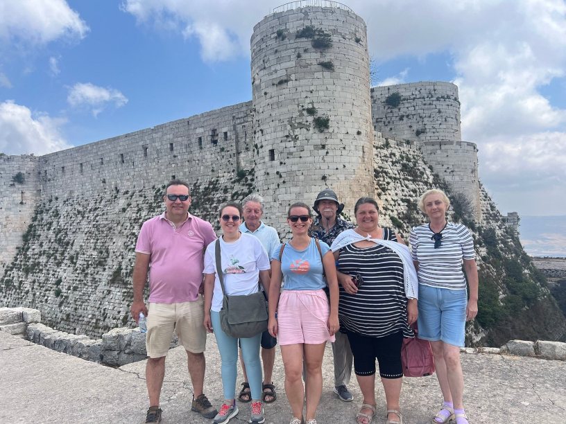 ola with a group of tourists in krak des chevaliers citadel